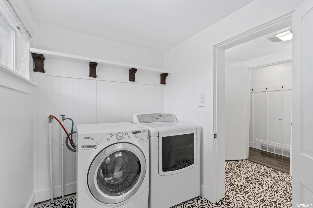 Laundry area featuring independent washer and dryer