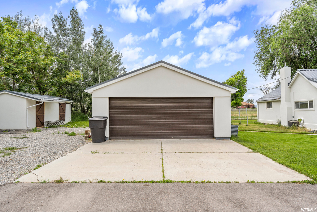 Garage with a lawn