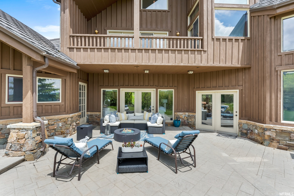 View of patio featuring fire pit and french doors