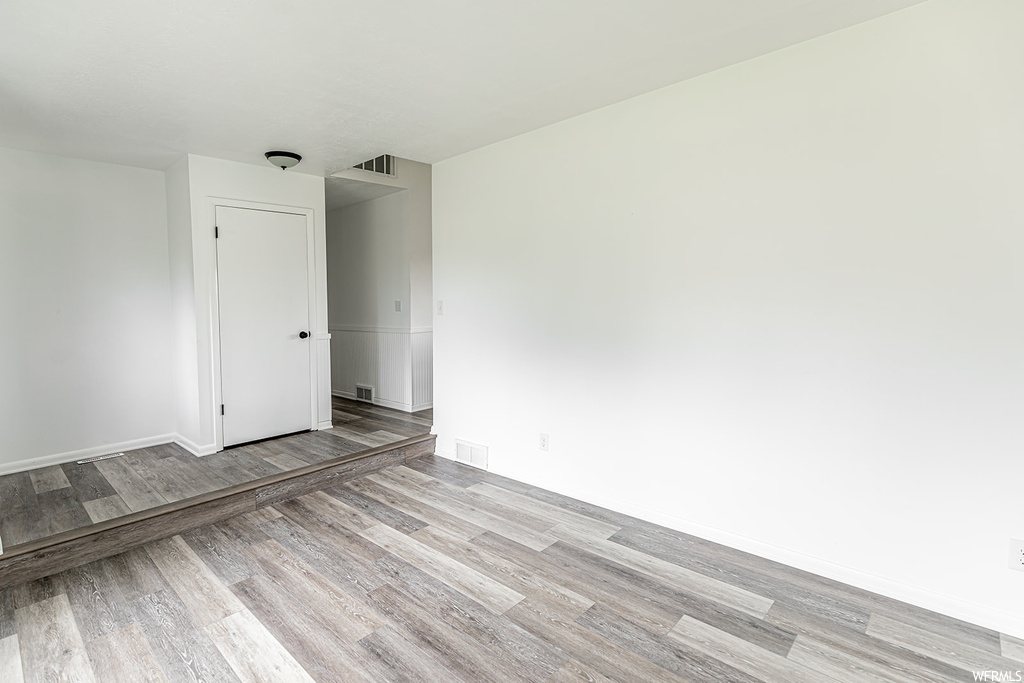 Spare room with hardwood floors