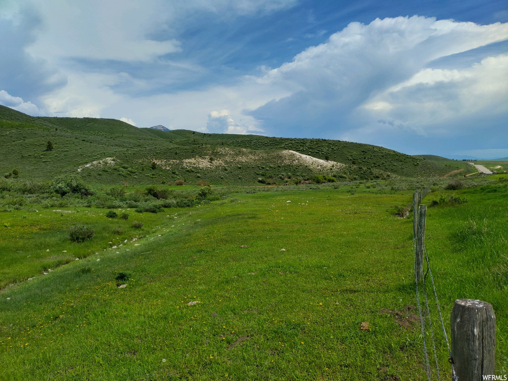 View of mountain feature with a lawn