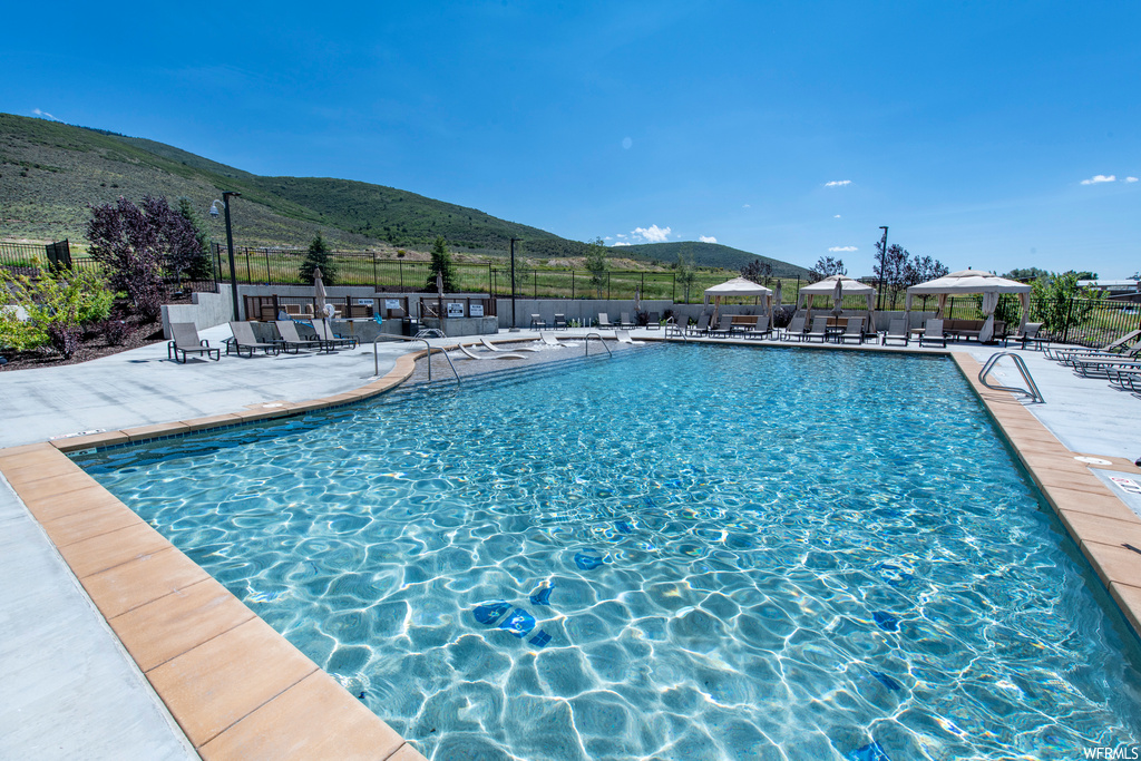 View of pool featuring a mountain view