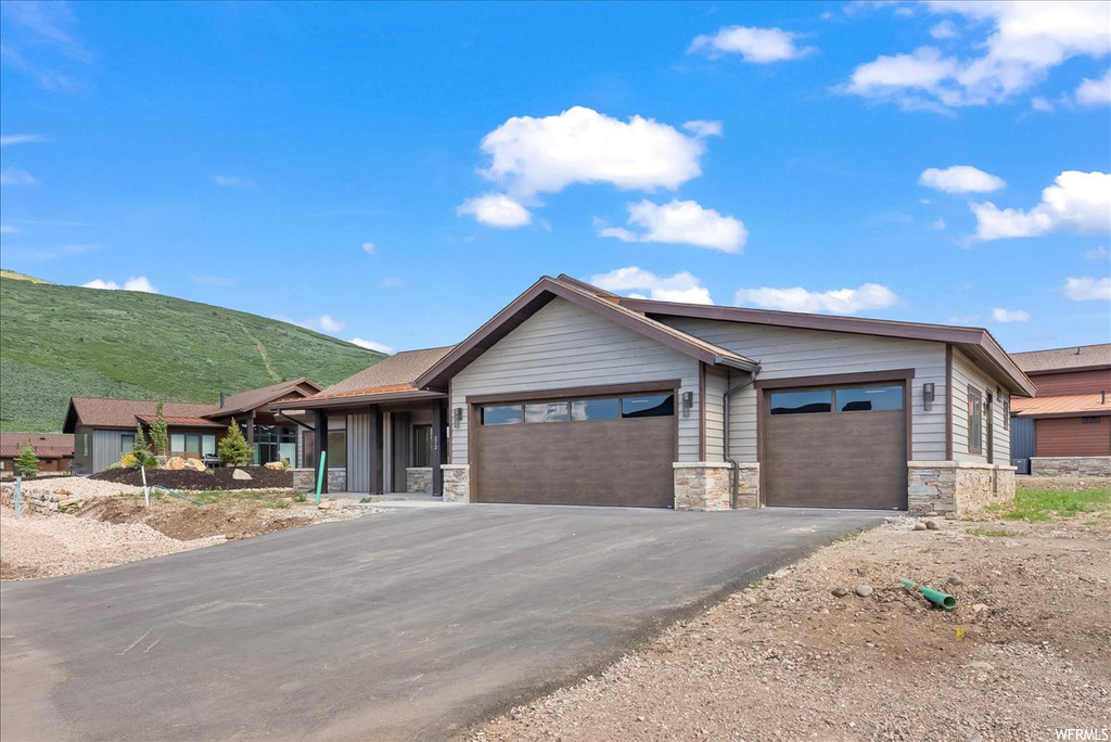 View of front of property with a mountain view