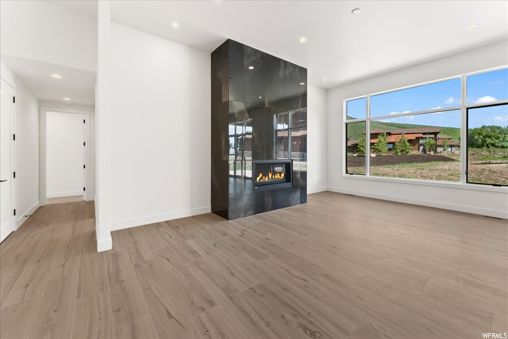 Hardwood floored living room with natural light