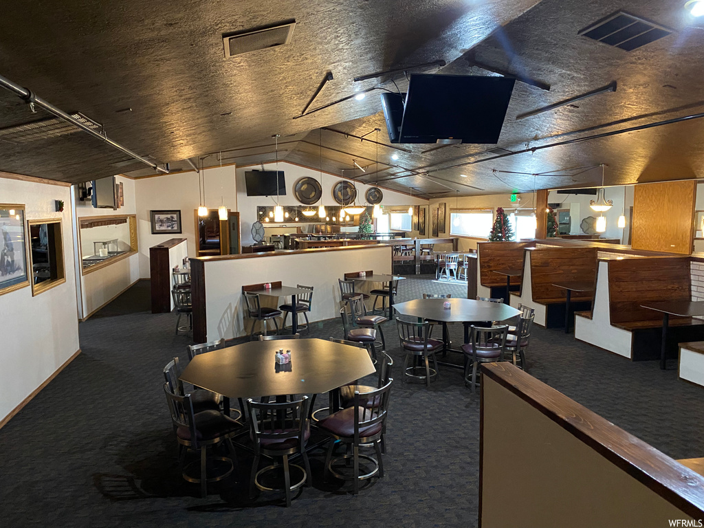 Dining area featuring a breakfast bar area and TV