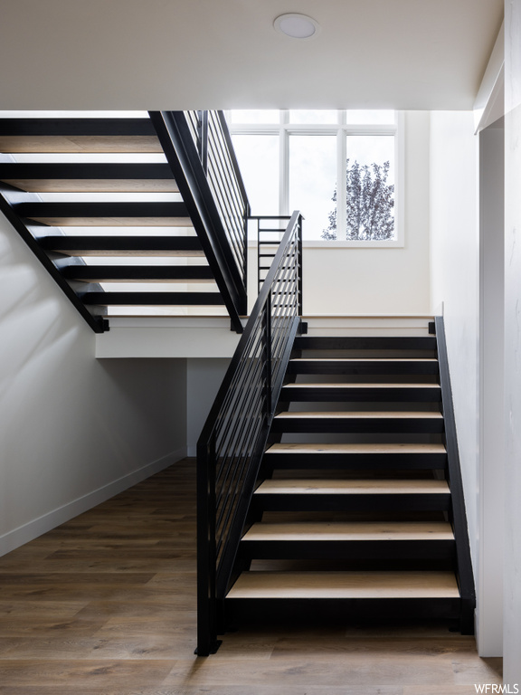 Staircase with dark hardwood floors