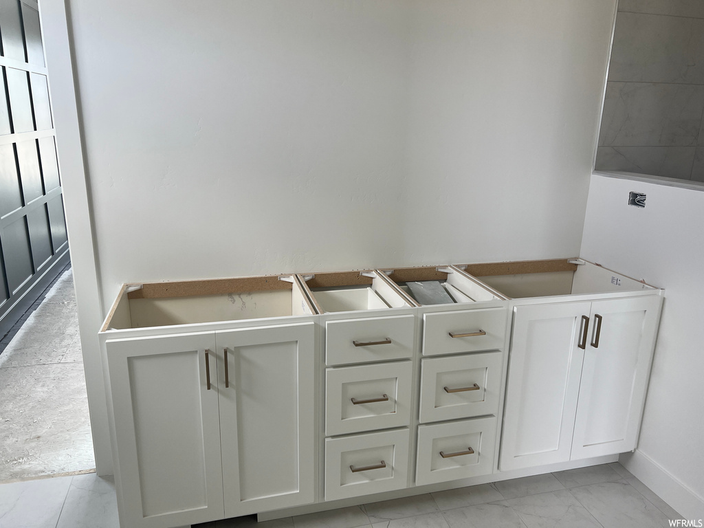 Bathroom with light tile flooring
