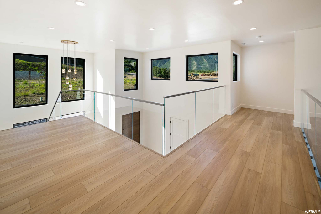 Interior space featuring natural light and hardwood flooring