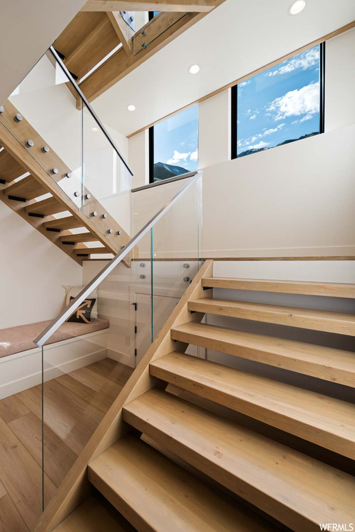 Stairs featuring skylight
