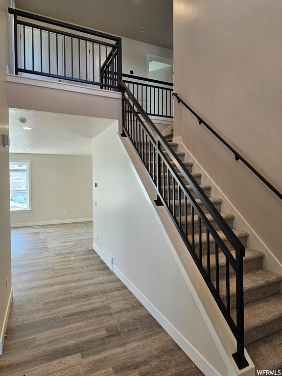 Staircase with hardwood floors
