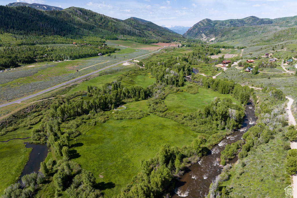 Bird's eye view with a water and mountain view