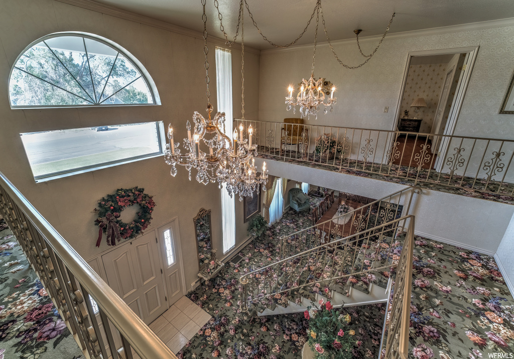 Foyer with a high ceiling and a chandelier