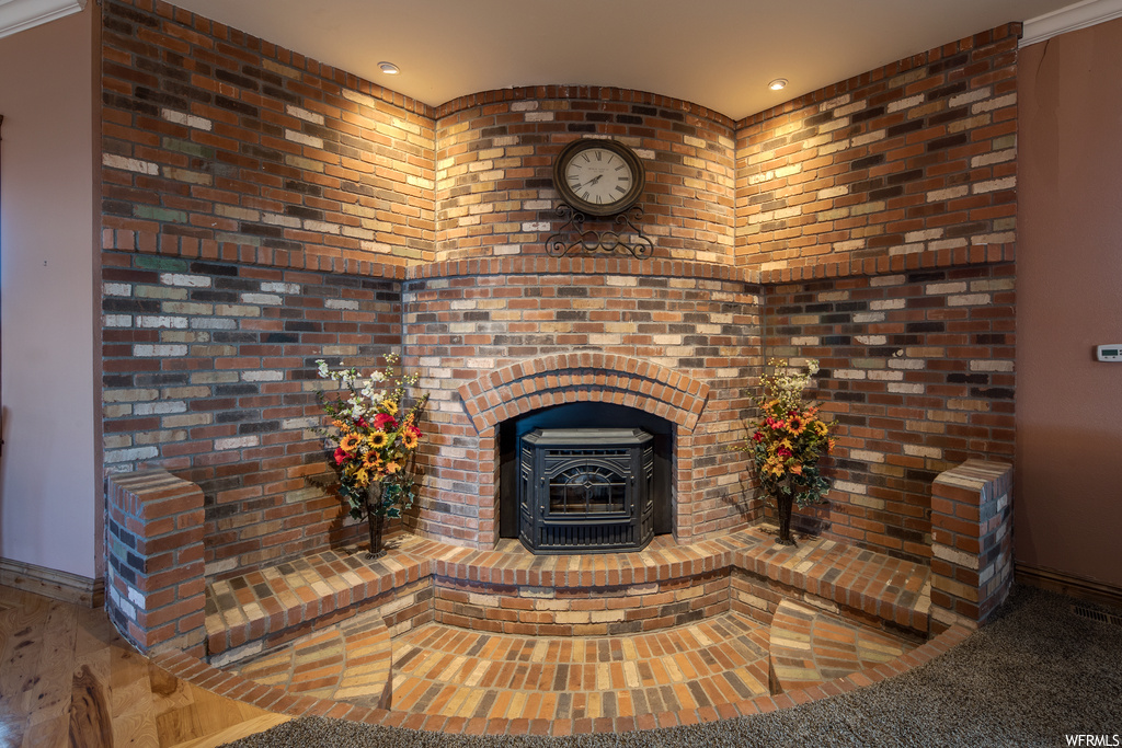 Living room featuring a brick fireplace