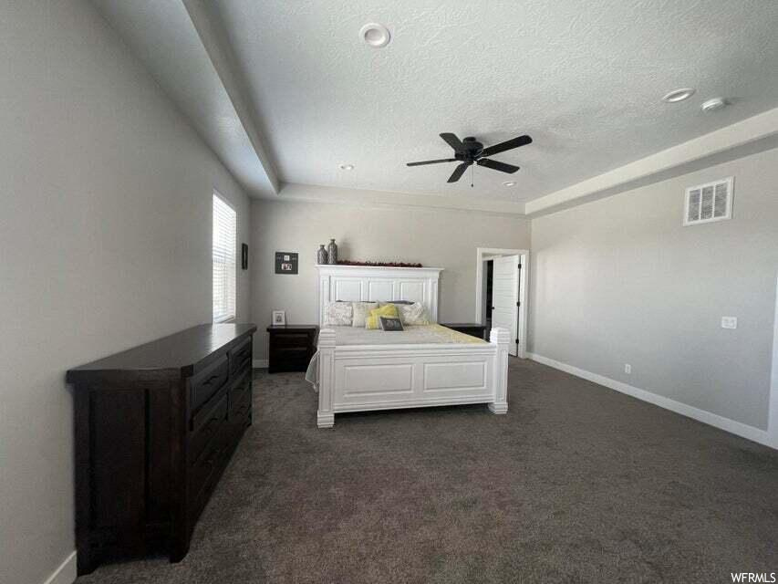 Bedroom with carpet and natural light