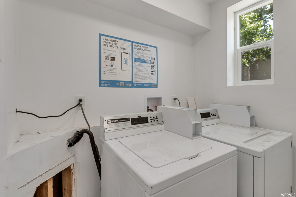 Laundry area featuring natural light and washer / dryer