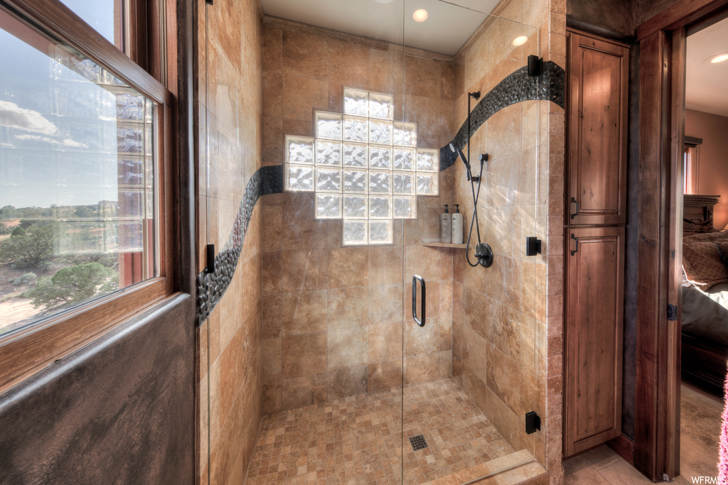 Bathroom featuring shower with glass door