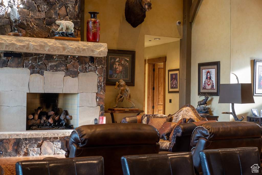 Living area featuring a stone fireplace