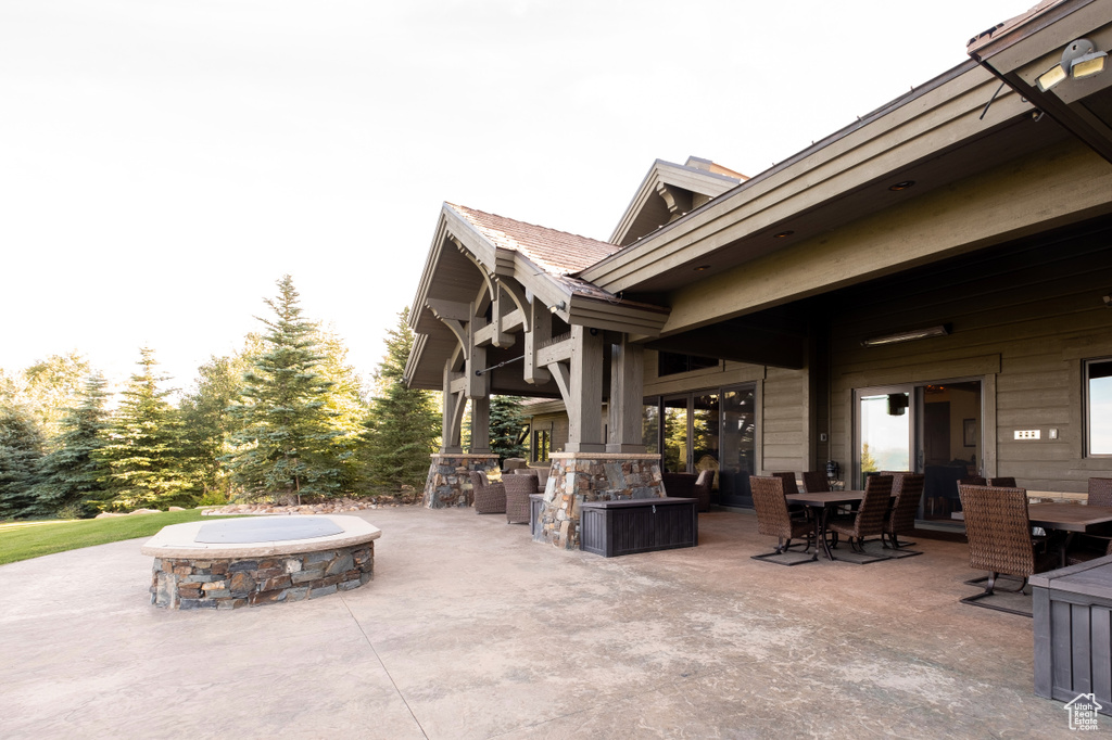 View of patio / terrace featuring outdoor dining area and an outdoor fire pit