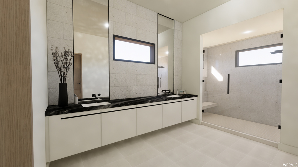 Bathroom with tile flooring, natural light, double sink vanity, and mirror
