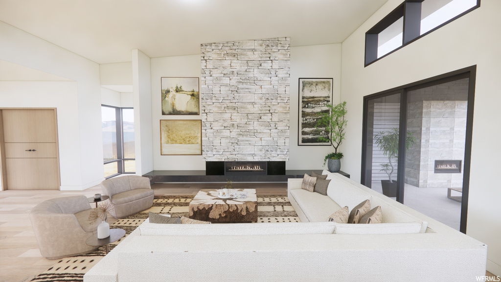 Living room featuring a fireplace and natural light