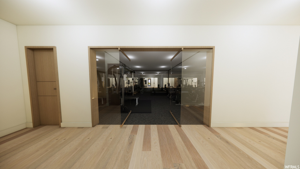 Corridor featuring wood-type flooring