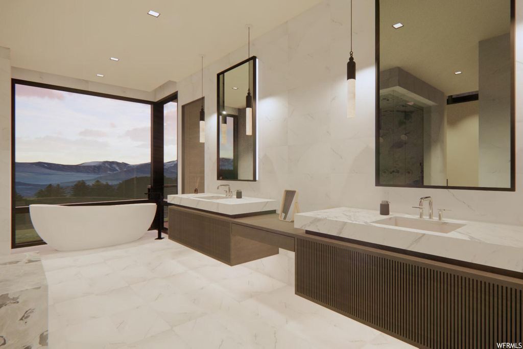 Bathroom featuring tile walls, a mountain view, tile floors, dual vanity, and a bath to relax in