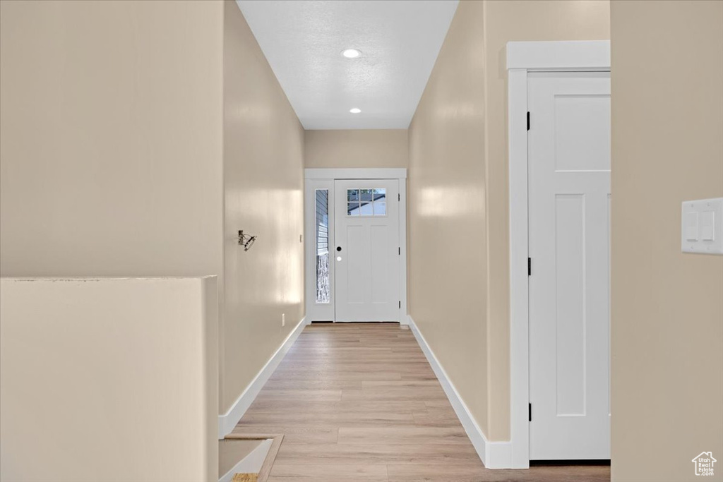 Doorway to outside featuring light hardwood / wood-style flooring
