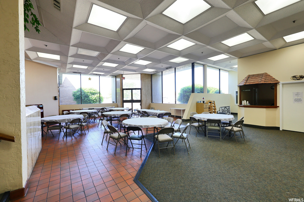 Dining area featuring a wealth of natural light and tile flooring