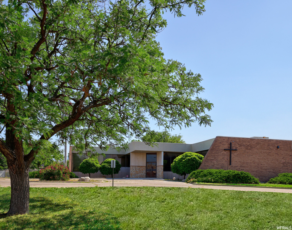 View of front of property with a front lawn