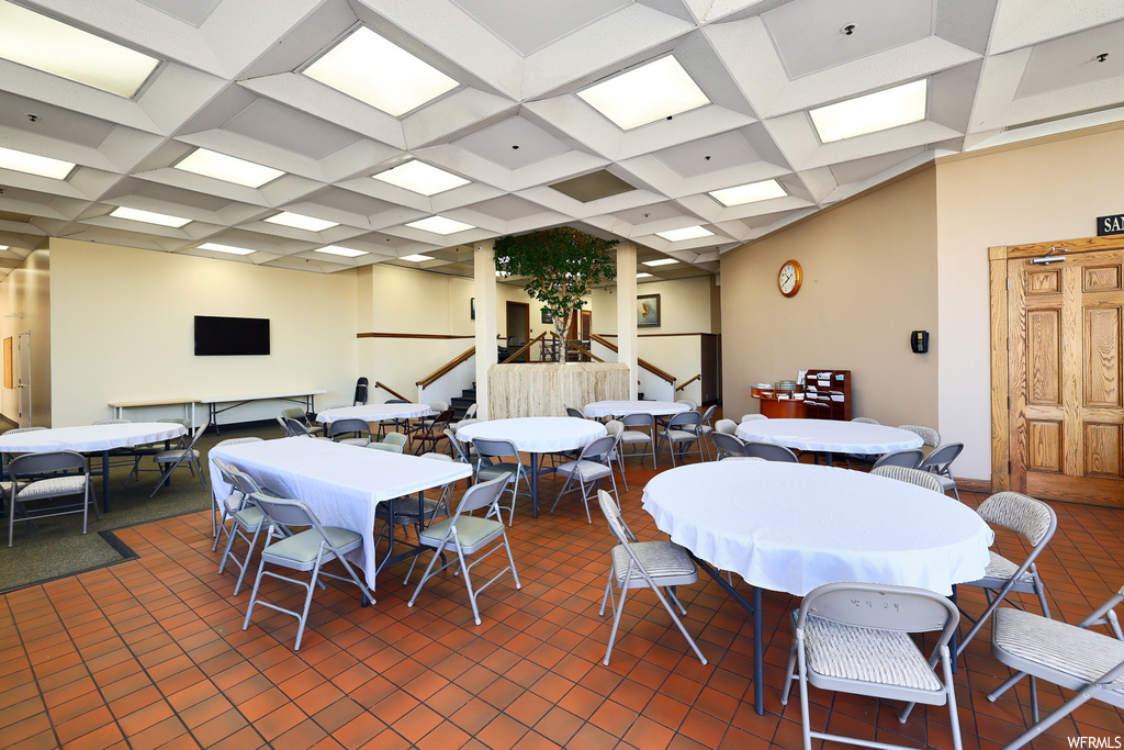 Dining room featuring beamed ceiling and coffered ceiling