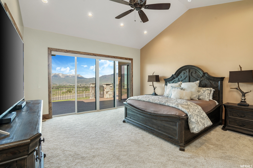 Bedroom featuring vaulted ceiling, carpet, a ceiling fan, natural light, and TV