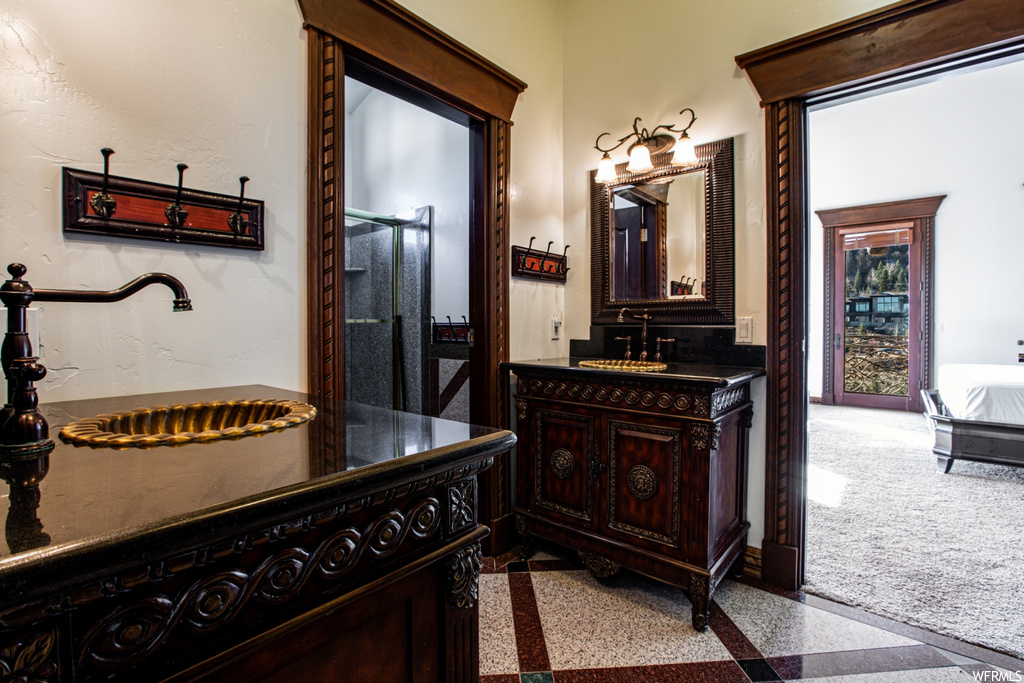 Bathroom with large vanity and a shower