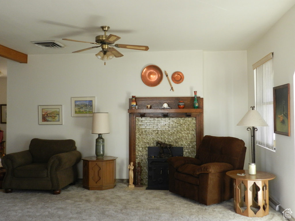 Living room with ceiling fan and carpet floors