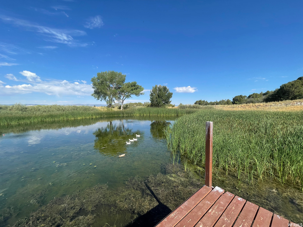 View of dock with a water view