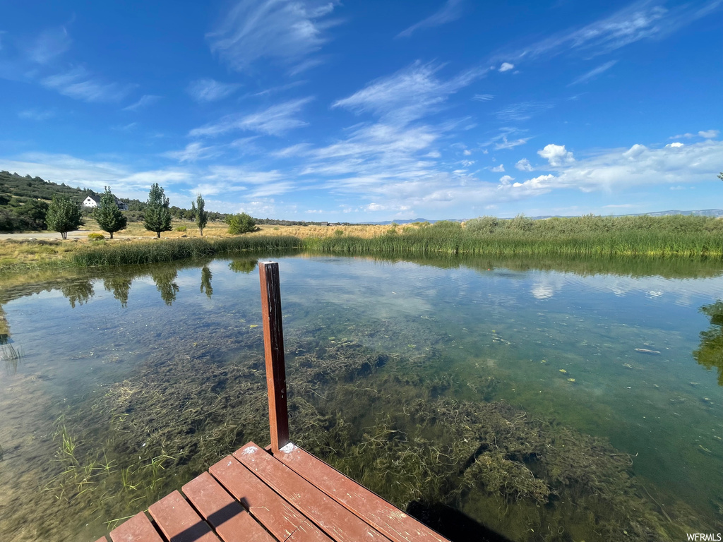 View of dock with a water view