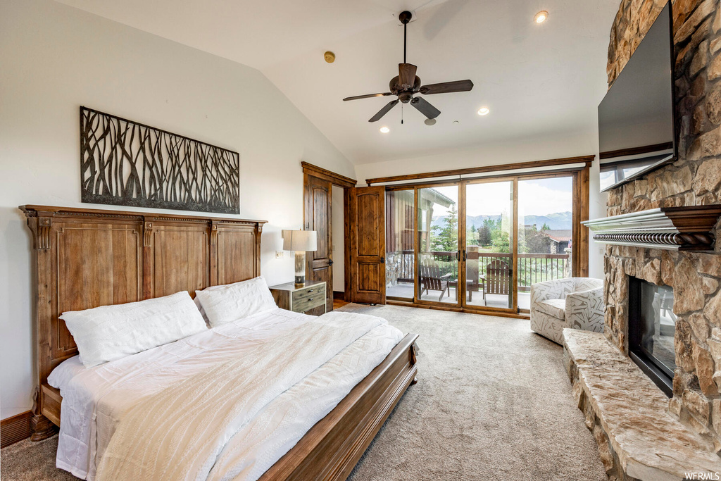 Bedroom featuring a fireplace, lofted ceiling, carpet, natural light, a ceiling fan, and TV
