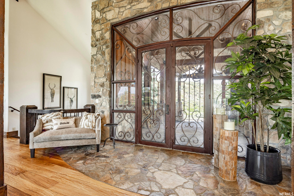 Foyer with french doors and hardwood flooring