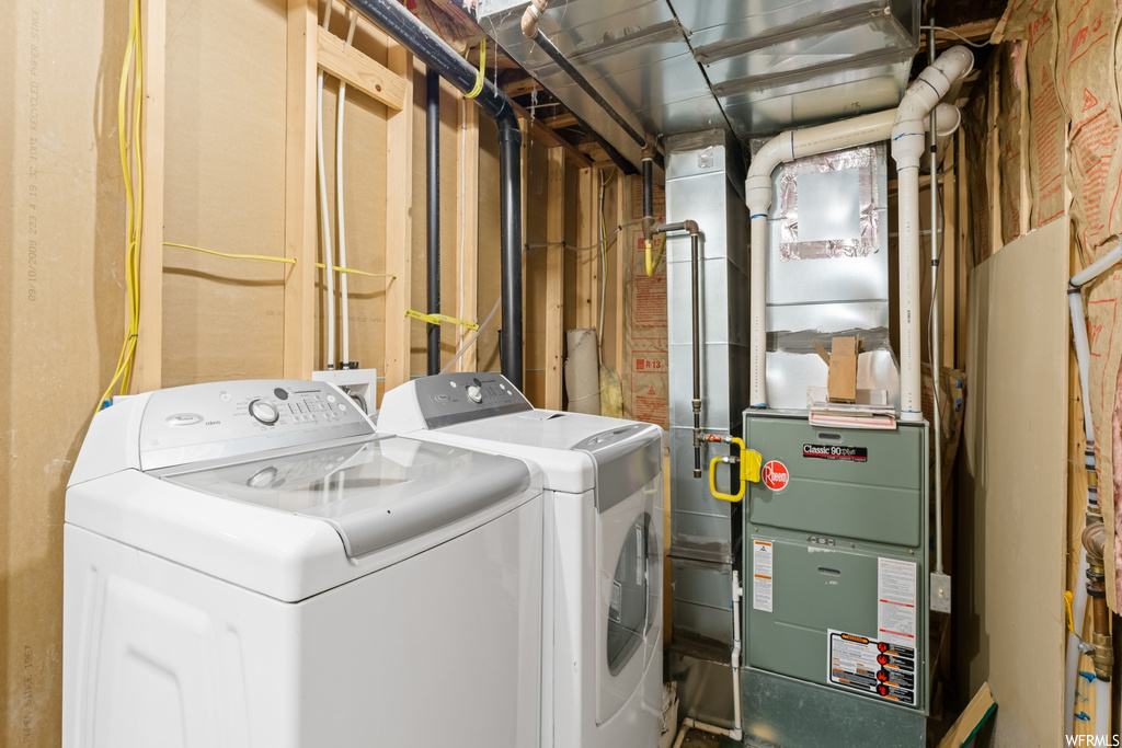 Laundry area featuring separate washer and dryer