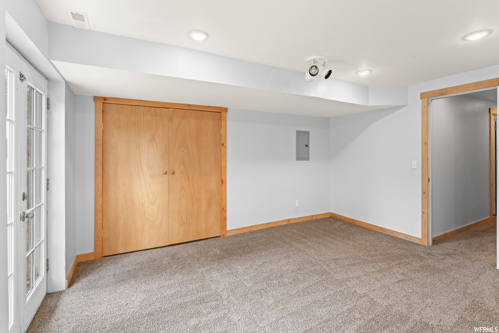 Bedroom with carpet and french doors