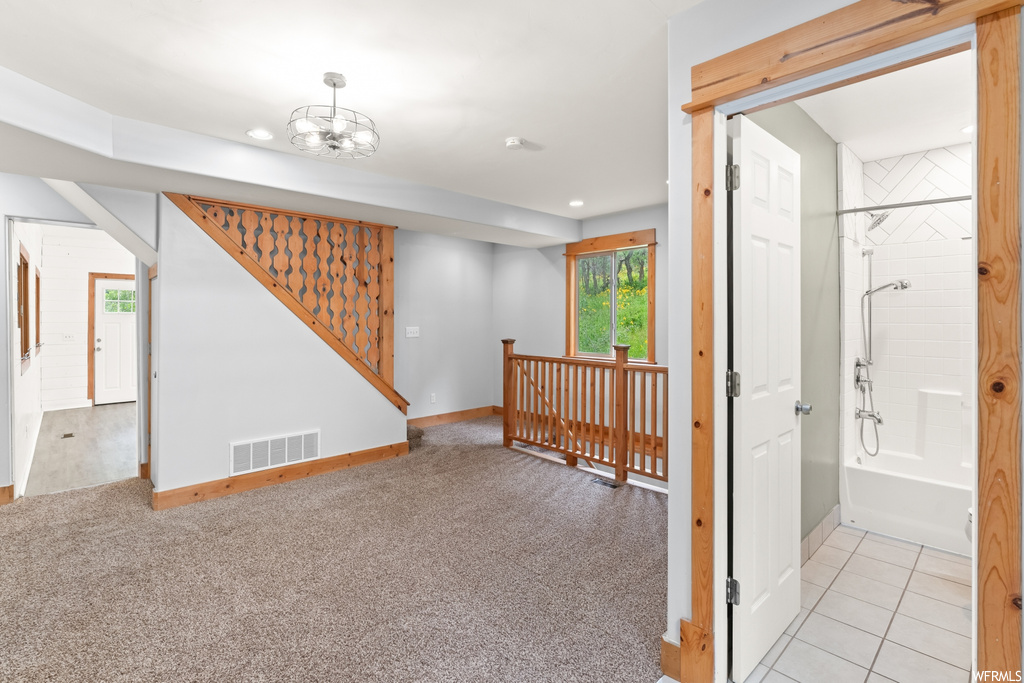 Carpeted spare room with a wealth of natural light