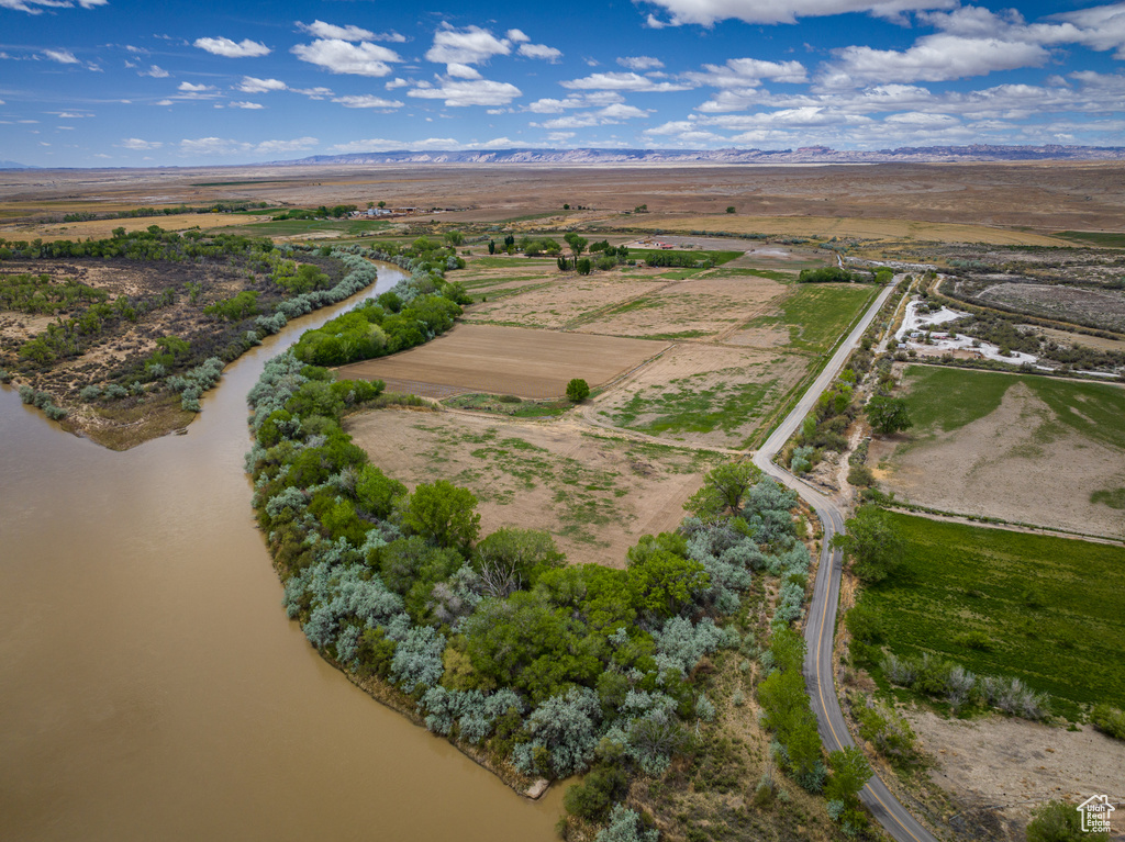 Bird's eye view with a water view and a rural view
