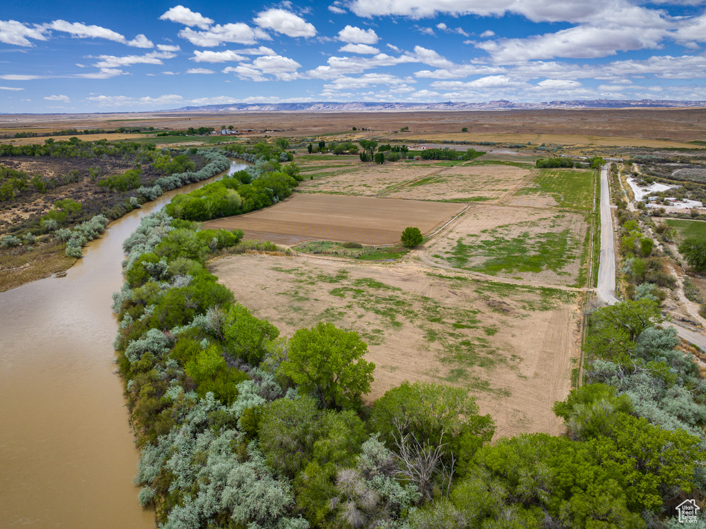 Birds eye view of property featuring a rural view and a water view