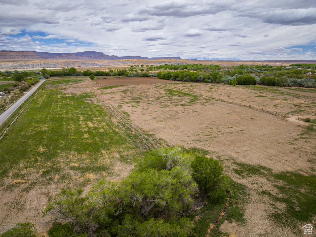 Birds eye view of property with a rural view and a mountain view