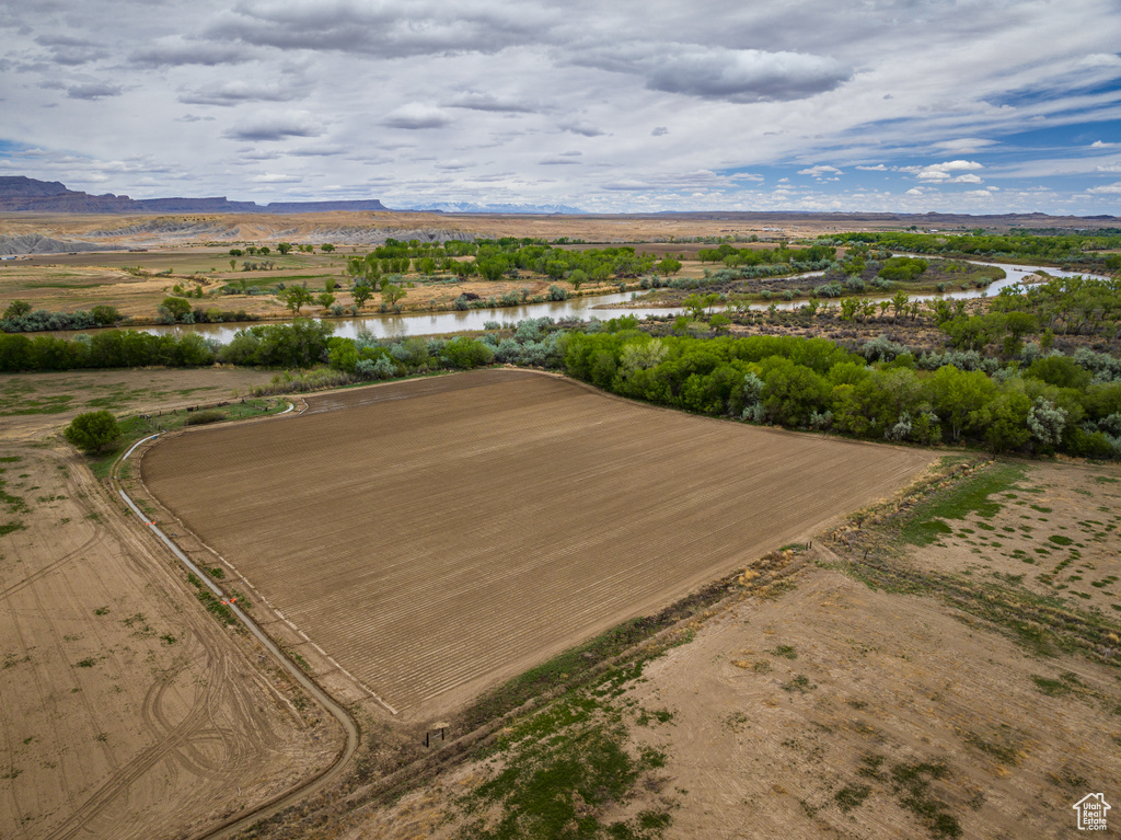 Birds eye view of property featuring a rural view and a water and mountain view