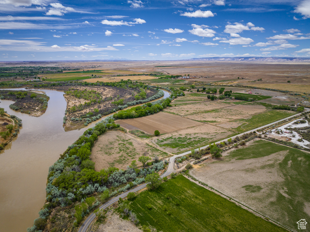 Drone / aerial view with a water view and a rural view
