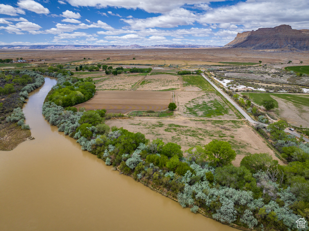 Aerial view featuring a water and mountain view