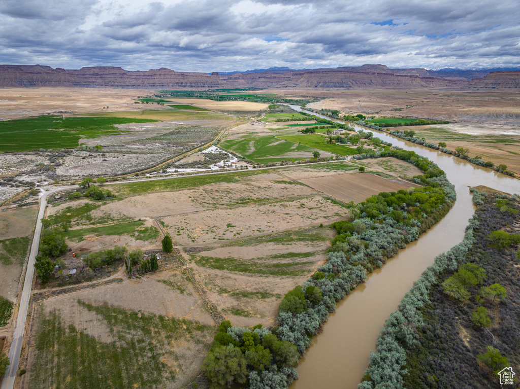 Birds eye view of property featuring a rural view and a water and mountain view