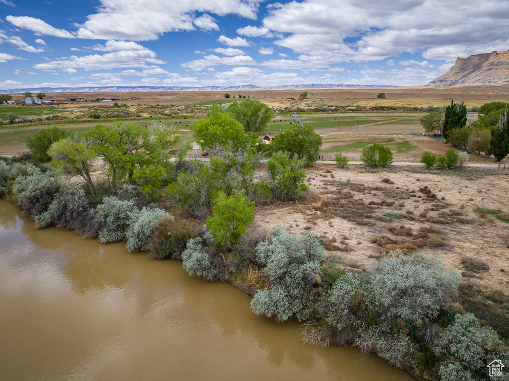 Aerial view featuring a water and mountain view