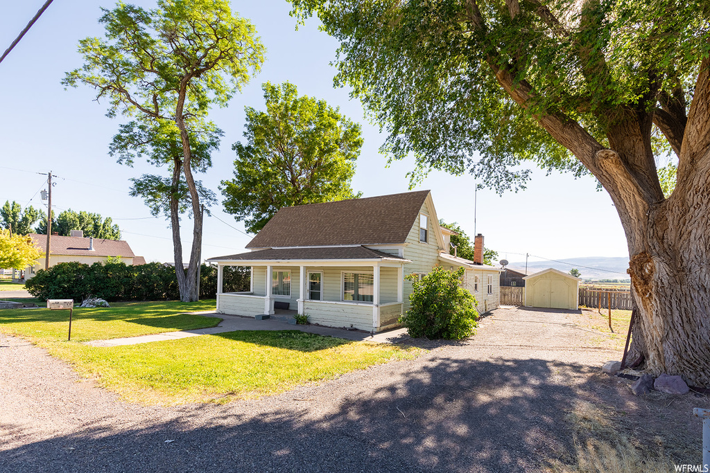 View of front of property with a front yard