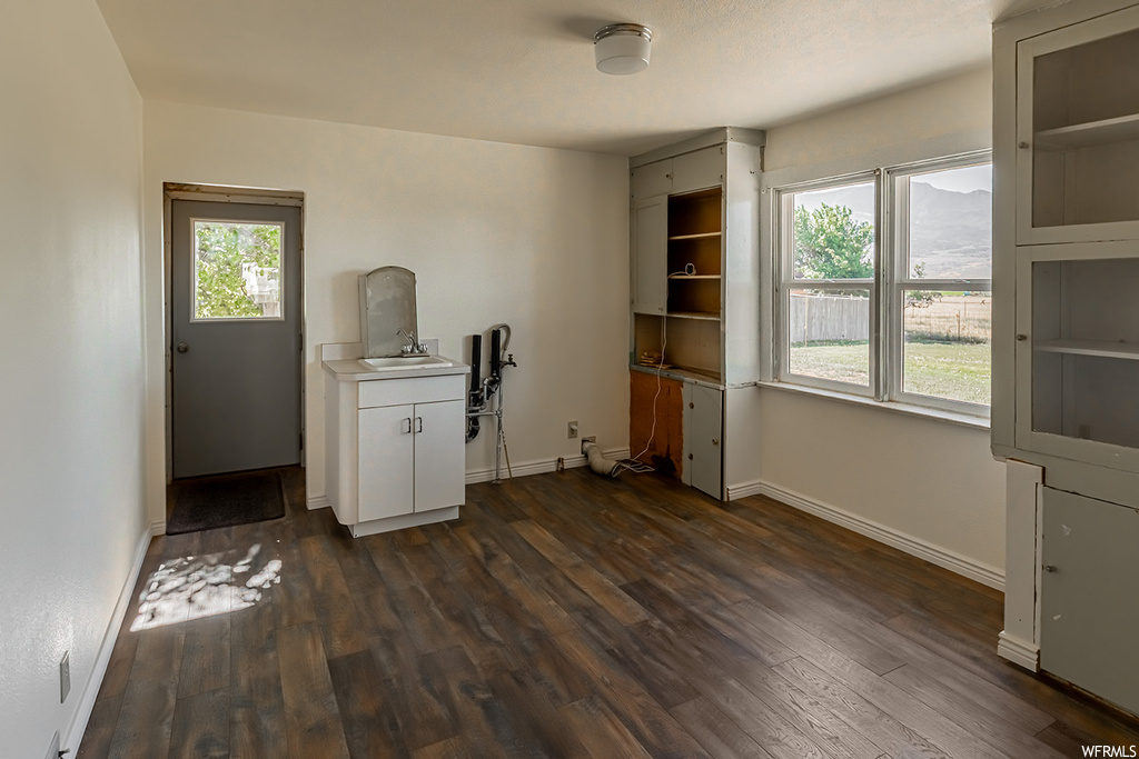 Miscellaneous room with hardwood floors and natural light